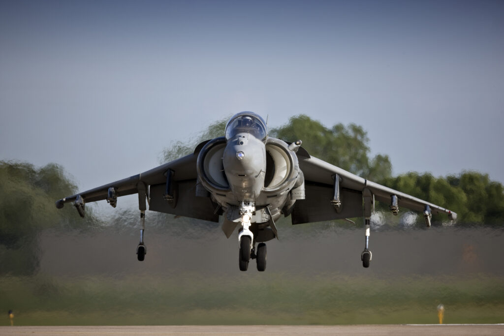 military plane actively taking off on the runway